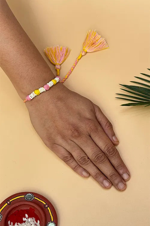 Antarang- Navrang Bead Rakhi- Set Of 2- Light Pink, Yellow Rakhi + Rani Pink, Blue Rakhi