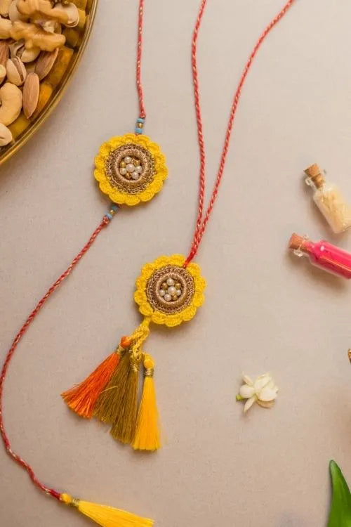 Samoolam Marigold Crochet Rakhi & Lumba Set (Set Of 2)