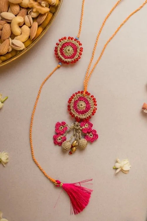 Samoolam Pink Twilight Crochet Rakhi & Lumba Set (Set Of 2)