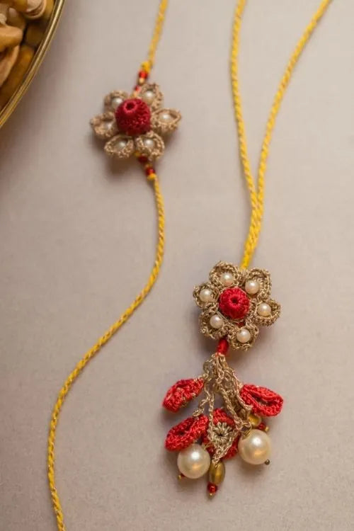 Samoolam Antique Flower Crochet Rakhi & Lumba Set (Set Of 2)