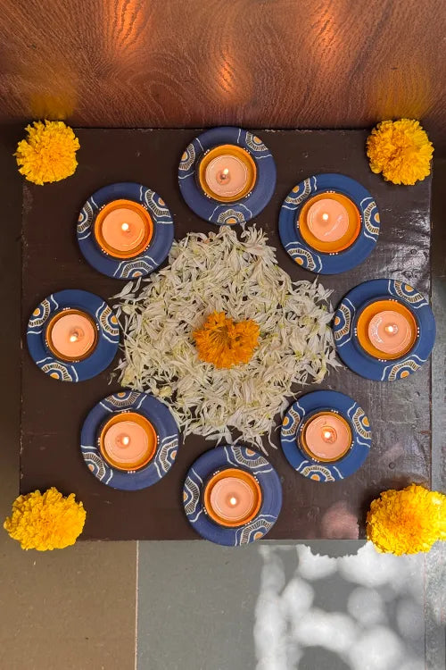 Antarang: Terracotta- Handpainted - Blue Bloom Disc Diya Set Of 8