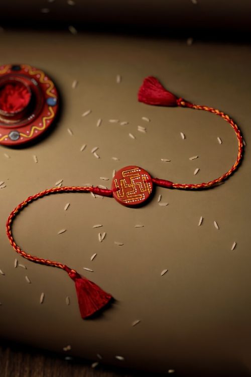 Antarang  (Set Of 2) Terracotta. Swastik- Handpainted Terracotta Rakhi.  Made By Divyang Rural Women