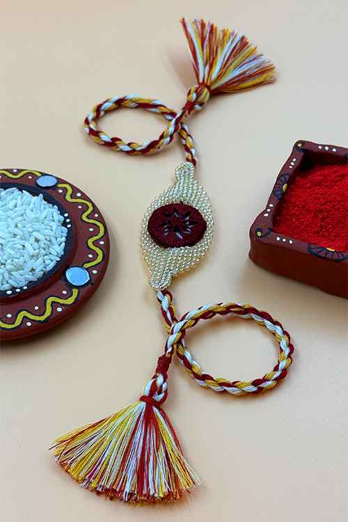 Antarang  (Set Of 2) Beaded Elegance Rakhi, 100% Cotton, Bhai Rakhi. Marron-Golden. Made By Divyang Rural Women