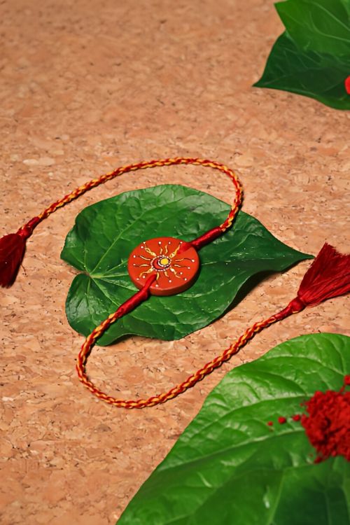 Antarang  (Set Of 2) Terracotta. Antarang-Terracotta. Suraj- Chanda- Handpainted Terracota Rakhi. Made By Divyang Rural Women
