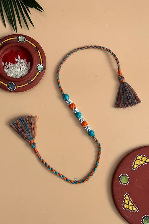 Antarang- Navrang Bead Rakhi- Set Of 2- Orange, Blue Rakhi + Red, Yellow Rakhi