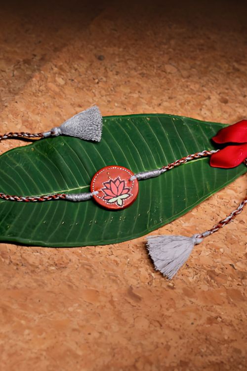 Antarang  (Set Of 2) Terracotta. Antarang-Terracotta.Kamal- Handpainted Terracotta Rakhi. Made By Divyang Rural Women.  Made By Divyang Rural Women