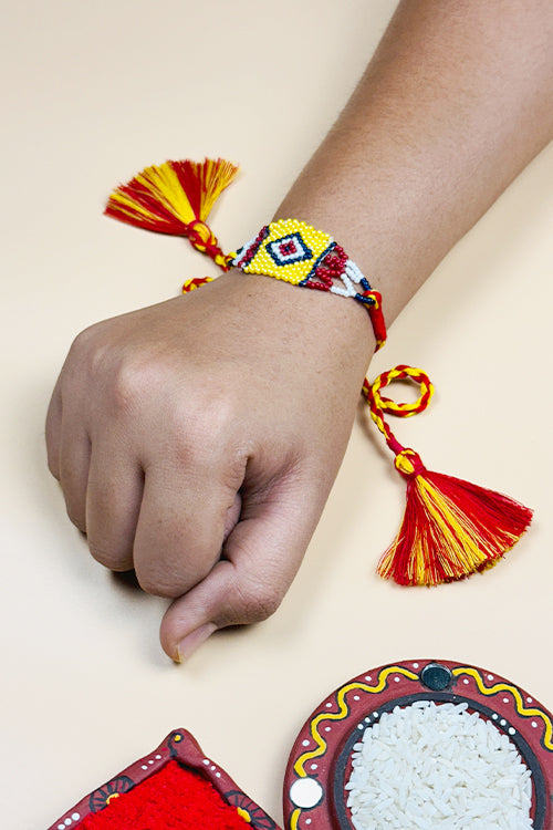 Antarang  (Set Of 2)  Traditional Saurastra Beadwork Rakhi, 100% Cotton, Bhai Rakhi. Yellow-Marron. Made By Divyang Rural Women