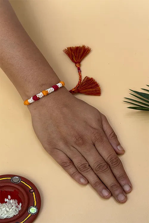 Antarang- Navrang Bead Rakhi- Set Of 2- Blue, Light Pink Rakhi + Maroon, Yellow Rakhi