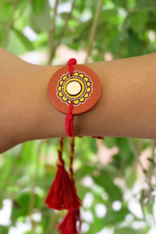 Antarang  (Set Of 2) Terracotta. Antarang-Terracotta.Suraj- Handpainted Terracotta Rakhi Made By Divyang Rural Women