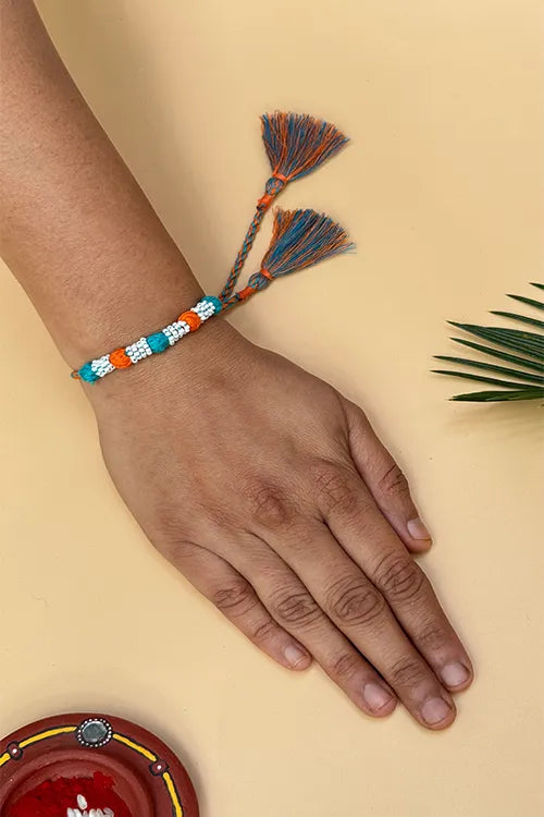 Antarang- Navrang Bead Rakhi- Set Of 2- Orange, Blue Rakhi + Red, Yellow Rakhi