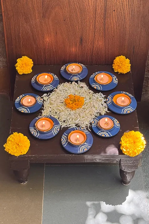 Antarang: Terracotta- Handpainted - Blue Bloom Disc Diya Set Of 8