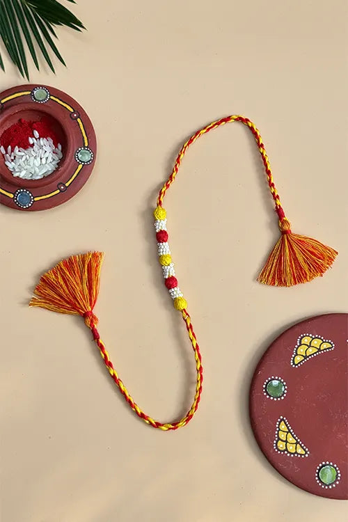 Antarang- Navrang Bead Rakhi- Set Of 2- Green, Yellow Rakhi+ Red, Bright Yellow Rakhi