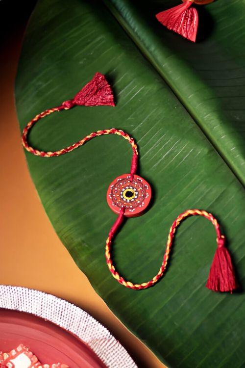 Antarang  (Set Of 2) Terracotta. Antarang-Terracotta. Taaramandal- Handpainted Terracotta Rakhi. Made By Divyang Rural Women