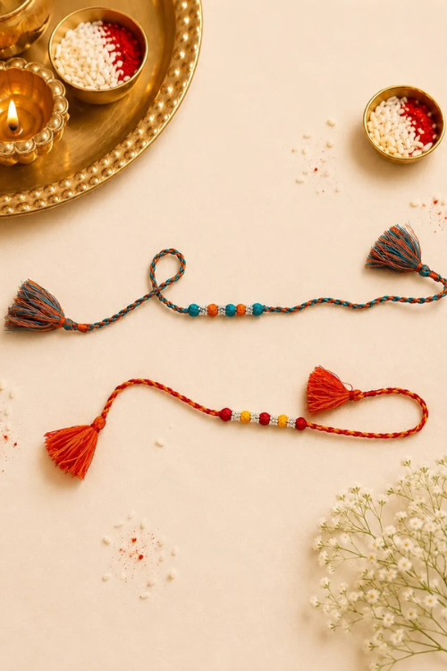 Antarang- Navrang Bead Rakhi- Set Of 2- Orange, Blue Rakhi + Red, Yellow Rakhi