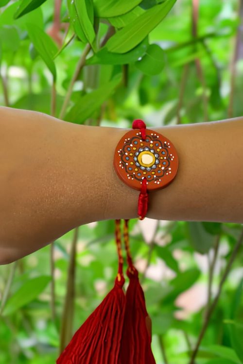 Antarang  (Set Of 2) Terracotta. Antarang-Terracotta. Taaramandal- Handpainted Terracotta Rakhi. Made By Divyang Rural Women