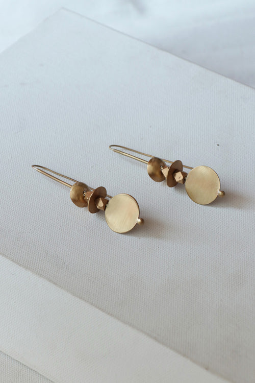 Lukka Chuppi Symmetry Drop earrings with brass off cut sheet.