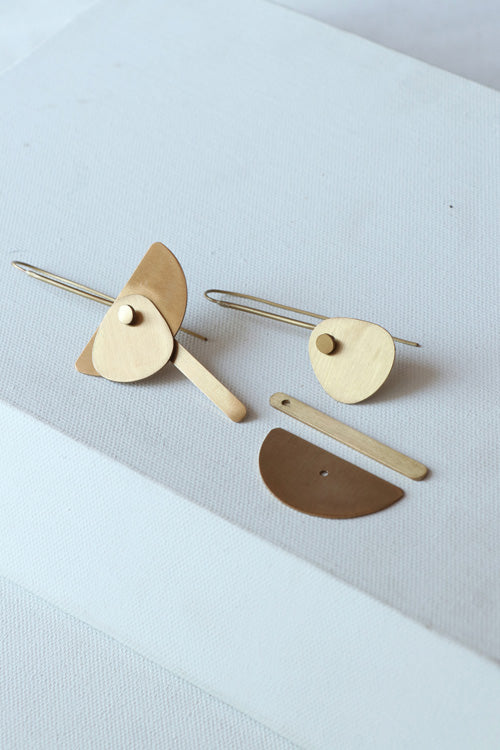 Lukka Chuppi Eterna balanced earrings with brass off cut sheet.