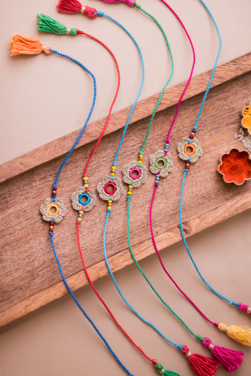 Samoolam Multicolor Golden Flower Rakhi (Set Of 6)