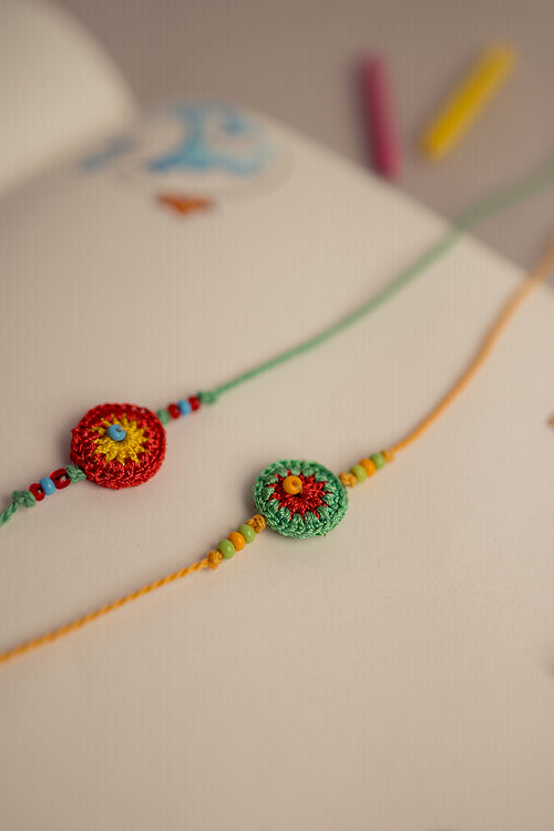 Samoolam Rakhi Set Green & Orange Ziba (Set Of 2)