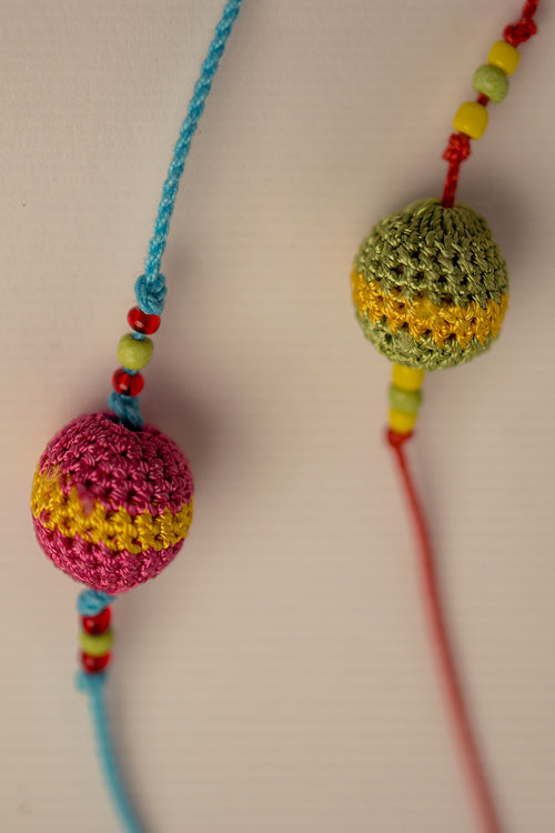 Samoolam Rakhi Suraj Multicolour Beads
(Set Of 2)