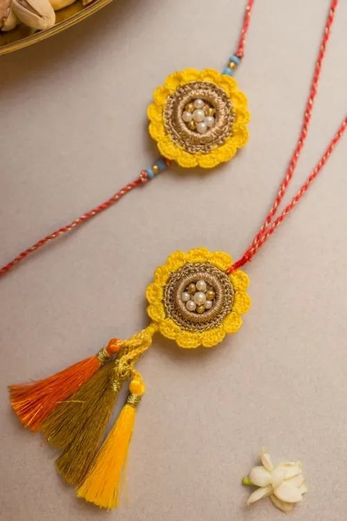Samoolam Marigold Crochet Rakhi & Lumba Set (Set Of 2)