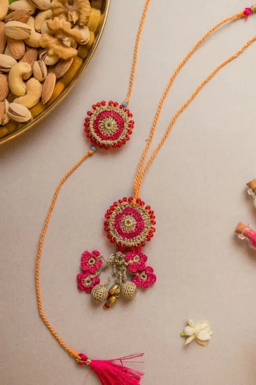 Samoolam Pink Twilight Crochet Rakhi & Lumba Set (Set Of 2)