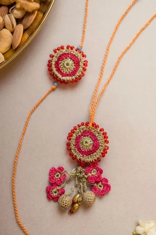 Samoolam Pink Twilight Crochet Rakhi & Lumba Set (Set Of 2)
