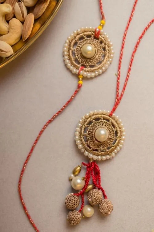 Samoolam Antique Pearl Crochet Rakhi & Lumba Set (Set Of 2)