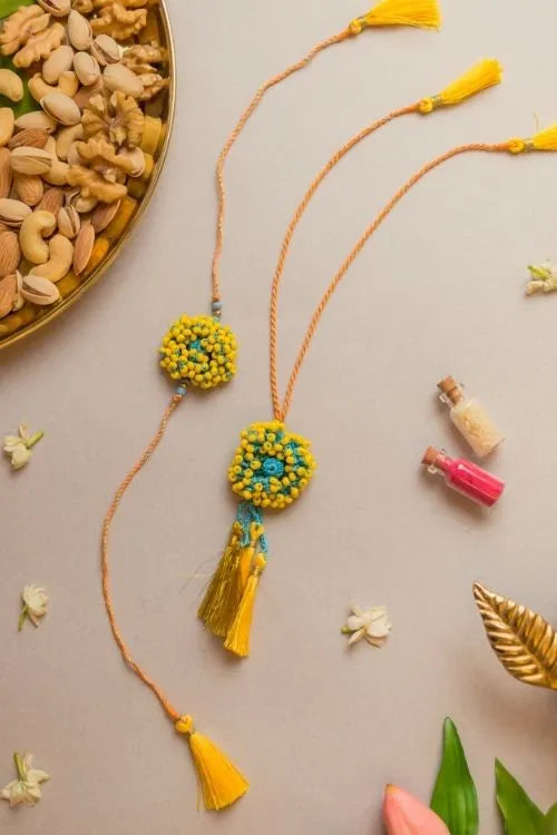 Samoolam Yellow Coral Crochet Rakhi & Lumba Set (Set Of 2)