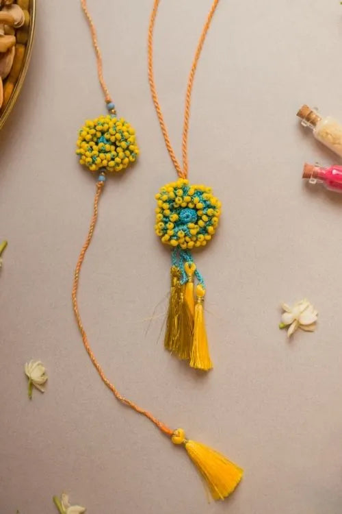 Samoolam Yellow Coral Crochet Rakhi & Lumba Set (Set Of 2)