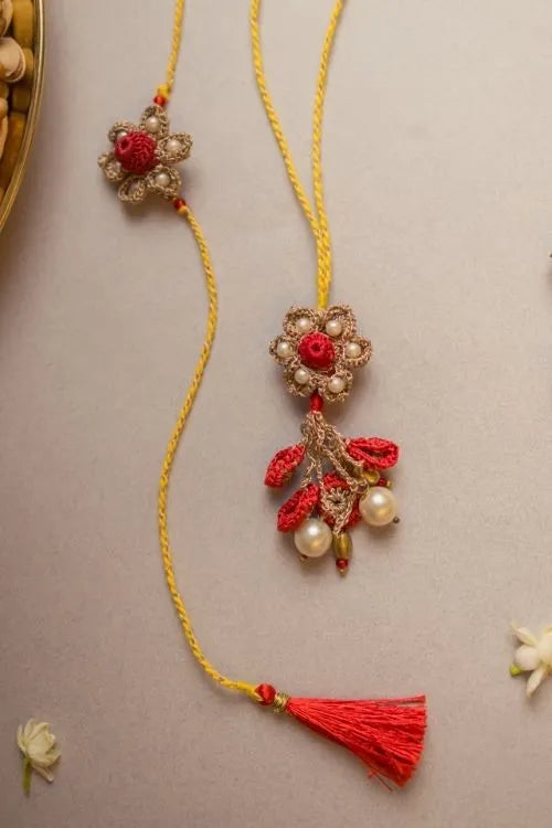 Samoolam Antique Flower Crochet Rakhi & Lumba Set (Set Of 2)