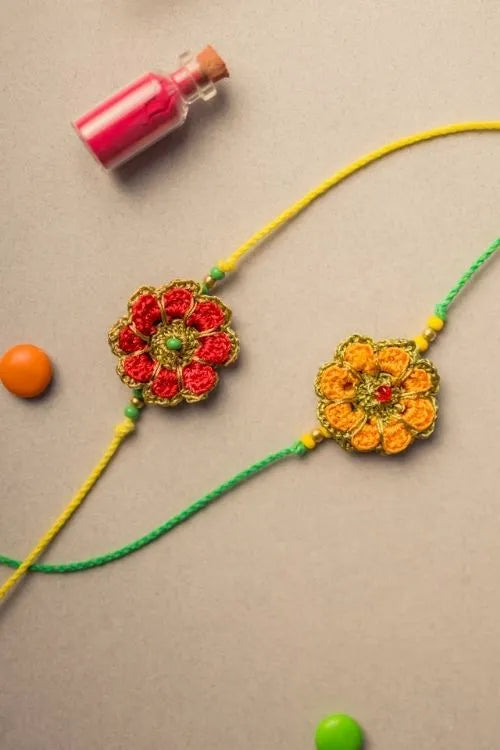 Samoolam Festive Marigold Crochet Rakhi Set (Set Of 2)