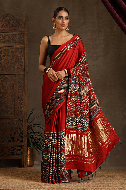 Tenaaro Traditional Ajrakh Hand Block Printed And Natural Dye Modal Silk Tissue Pallu Saree With Beautiful Tassels