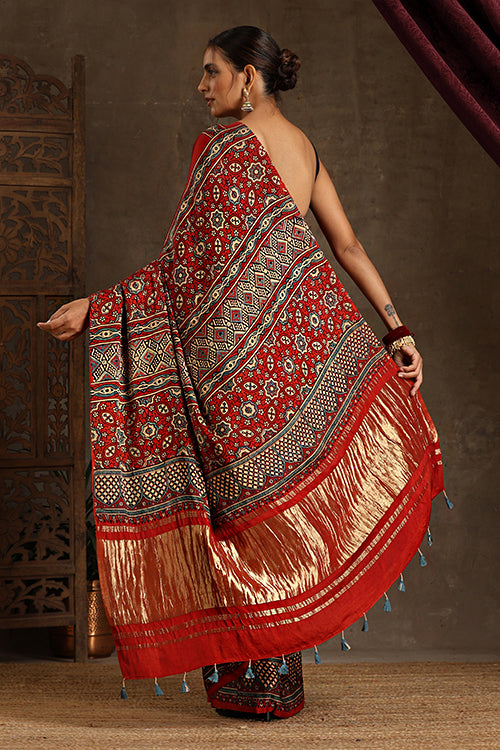 Tenaaro Traditional Ajrakh Hand Block Printed And Natural Dye Modal Silk Tissue Pallu Saree With Beautiful Tassels