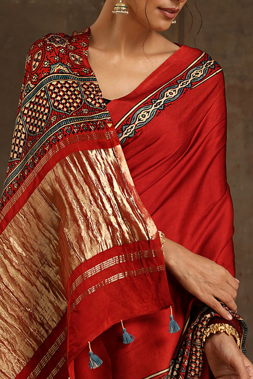 Tenaaro Traditional Ajrakh Hand Block Printed And Natural Dye Modal Silk Tissue Pallu Saree With Beautiful Tassels