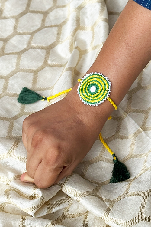 Antarang Yellow Green Bhai-Bhabhi Rakhi Set